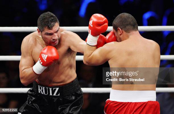 Adnan Serin of Germany and John Ruiz of the USA compete during their heavyweight fight at the Arena Nuernberger Versicherung on November 7, 2009 in...
