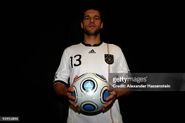 Michael Ballack poses with a ball after the presentation of the new German FIFA World Cup 2010 jersey 'Teamgeist' at the adidas Brand Center on...