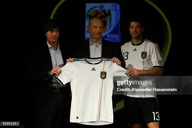 Head coach Joachim Loew, Erich Stamminger, member of the executive board, global brands of Adidas and Michael Ballack present the new German FIFA...