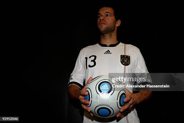 Michael Ballack poses with a ball after the presentation of the new German FIFA World Cup 2010 jersey 'Teamgeist' at the adidas Brand Center on...