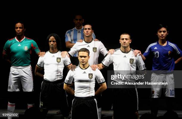 Models present the new German FIFA World Cup 2010 jersey 'Teamgeist' at the adidas Brand Center on November 10, 2009 in Herzogenaurach, Germany.