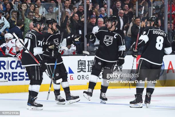 Torrey Mitchell, Kyle Clifford, Anze Kopitar, and Drew Doughty of the Los Angeles Kings celebrate after scoring a goal against the Washington...