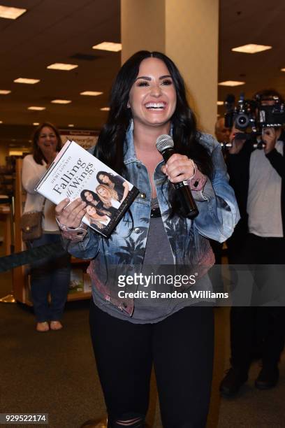 Singer-songwriter Demi Lovato attends her mother, author Dianna De La Garza's book signing of "Falling with Wings" at Barnes & Noble at The Grove on...