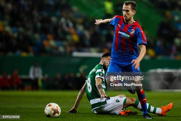 Sporting's midfielder Bruno Fernandes vies with Plzen's midfielder Tomas Horava during the UEFA Europa League round of 16 match between Sporting CP...