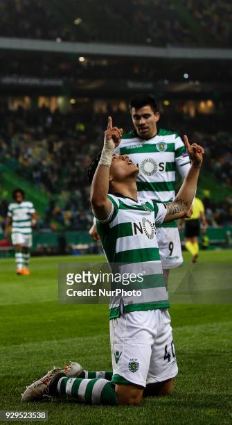 Sporting's Colombian forward Fredy Montero celebrates a goal with Sporting's Argentinian forward Marcos Acuna during the UEFA Europa League round of...