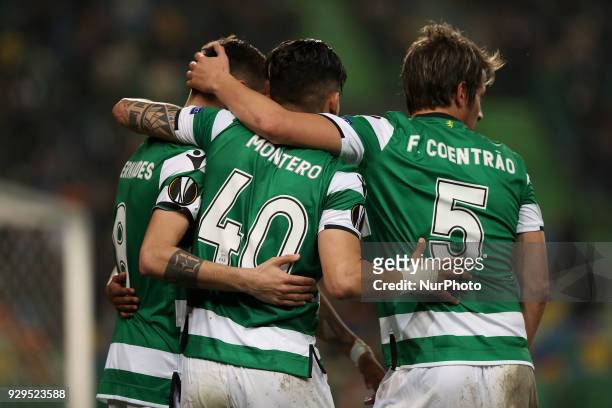 Sporting's forward Fredy Montero celebrates with teammates after scoring during the UEFA Europa League round of 16 1st leg football match Sporting CP...