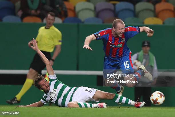 Sporting's defender Fabio Coentrao from Portugal fights for the ball with Plzen's forward Michael Krmencik of Czech Republic during the UEFA Europa...