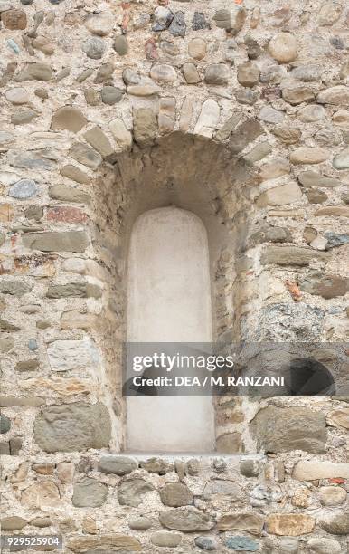 Lancet window on the left side of the Collegiate church of St Stephen, Vimercate, Lombardy, Italy, 11th-12th century.