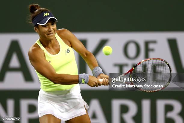 Heather Watson of Great Britain returns a shot to Victoria Azarenka of Belarus during the BNP Paribas Open at the Indian Wells Tennis Garden on March...