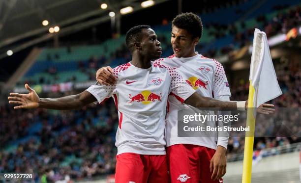 Bruma of RB Leipzig celebrates with team mate Bernardo after scoring his team's first goal during UEFA Europa League Round of 16 match between RB...