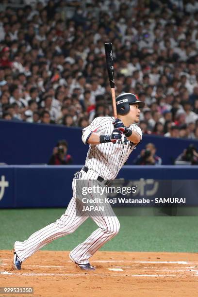 Yoshitomo Tsutsugoh of Japan bats during the game one of the baseball international match between Japan And Australia at the Nagoya Dome on March 3,...