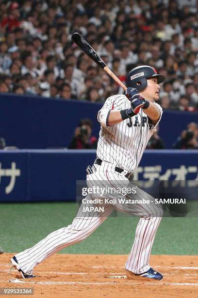 Yoshitomo Tsutsugoh of Japan bats during the game one of the baseball international match between Japan And Australia at the Nagoya Dome on March 3,...