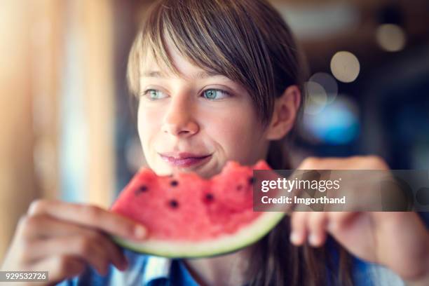 portrait of a girl eating watermelon - children fruit stock pictures, royalty-free photos & images