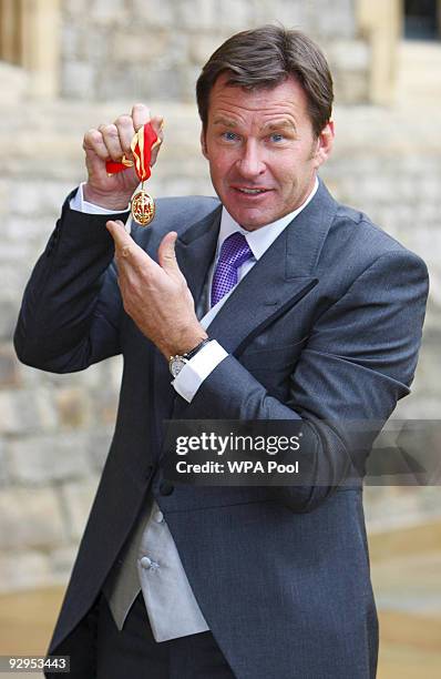 Sir Nick Faldo poses with his knighthood after receiving it from Queen Elizabeth II at Windsor Castle on Novembert 10, 2009 in Windsor, England. The...