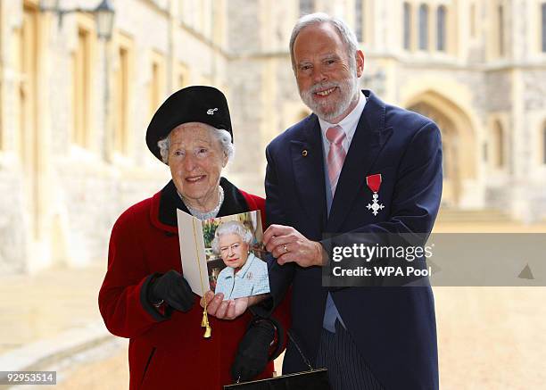 Michael Ward from Staffordshire poses with his MBE after receiving it from Queen Elizabeth II at Windsor Castle on November 10, 2009 in Windsor,...