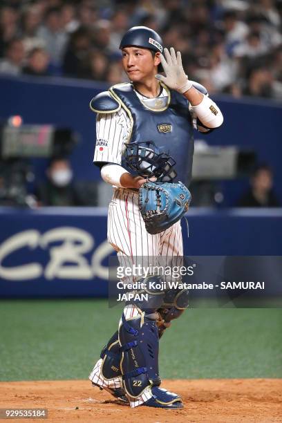 Seiji Kobayashi of Japan responds during the game one of the baseball international match between Japan And Australia at the Nagoya Dome on March 3,...