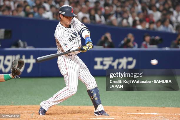 Seiji Kobayashi of Japan bats during the game one of the baseball international match between Japan And Australia at the Nagoya Dome on March 3, 2018...