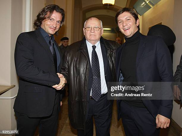 Manuele Malenotti and Michele Malenotti , Vice presidents of Belstaff, greet former Soviet President Mikhail Gorbachev at the 10th World Summit of...