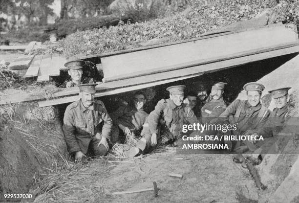 British sailors sheltering from bombs in a trench, Antwerp, Belgium, World War I, from L'Illustrazione Italiana, Year XLI, No 43, October 25, 1914.