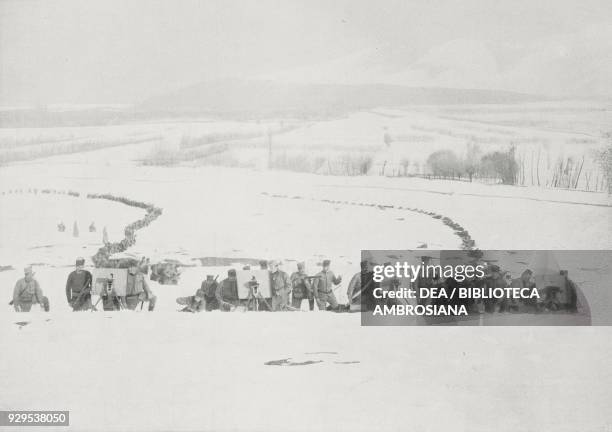 Serbian machine guns in the snow, Serbia, photograph by S Tchernoff, from L'Illustrazione Italiana, Year XLI, No 51, December 20, 1914.