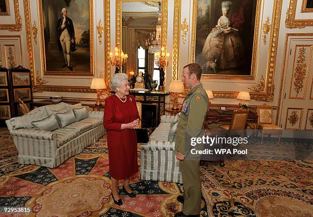 Queen Elizabeth II shakes hands with Australian Trooper Mark Donaldson VC, during a private audience at Windsor Castle, on November 10, 2009 in...