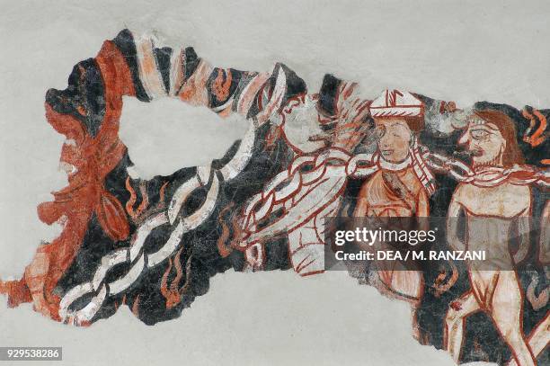 Rows of the damned in chains and lost souls tormented by demons, detail from Hell, fresco on the counterfacade, church of San Michele al Pozzo Bianco...
