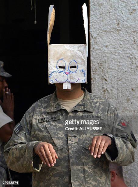 Army medic wears a bunny mask as he celebrates Easter in Tarmiyah, north of Baghdad, on April 12, 2009. Violence in Iraq "remains at 2003 lows" and a...