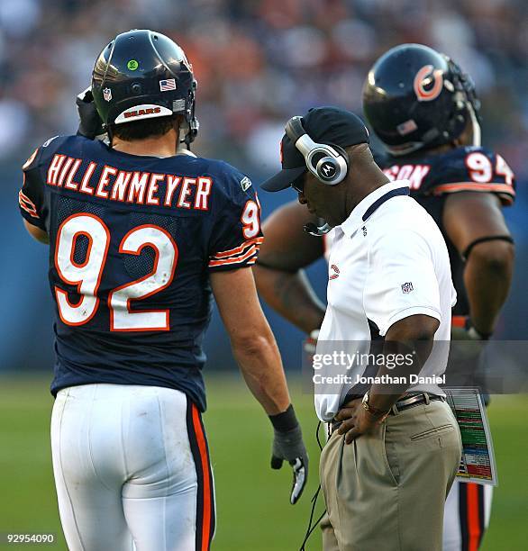 Head coach Lovie Smith of the Chicago Bears reacts as his defensive players including Marcus Harrison and Hunter Hillenmeyer leave the field late in...