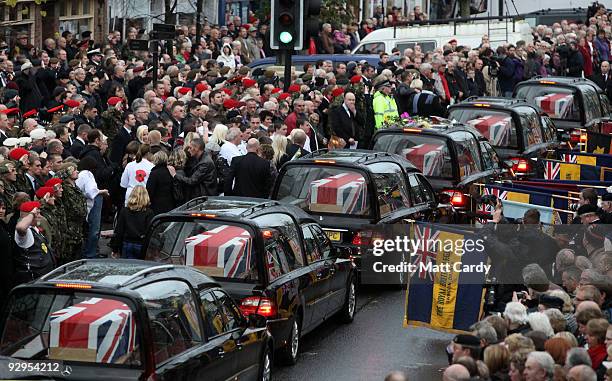 Friends and family pay their respects, as the hearses carrying the coffins of six dead soldiers pass mourners lining the High Street on November 10,...