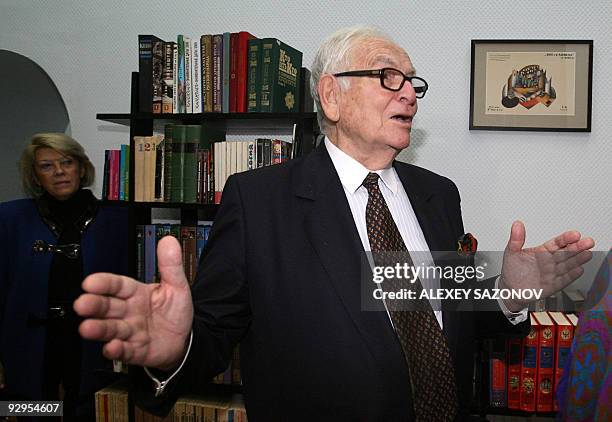 French fashion designer Pierre Cardin gestures while speaking during a visit to the Eisenstein cinema arts library in Moscow on November 9, 2009....