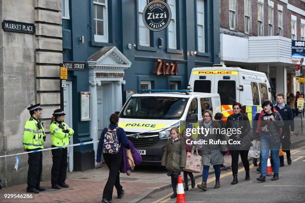 Police stand guard at Zizzil restaurant reported to have been visited by Sergei Skripal before he colapsed due to poisoning on March 8, 2018 in...