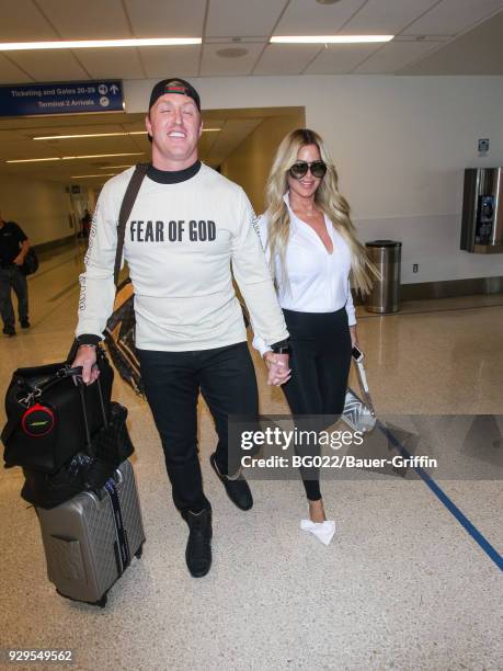 Kim Zolciak-Biermann and Kroy Biermann are seen at Los Angeles International Airport on March 08, 2018 in Los Angeles, California.