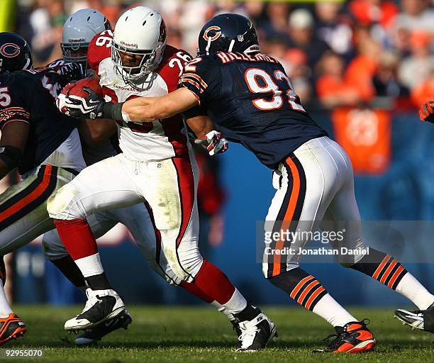 Beanie Wells of the Arizona Cardinals is grabbed by Hunter Hillenmeyer of the Chicago Bears at Soldier Field on November 8, 2009 in Chicago,...
