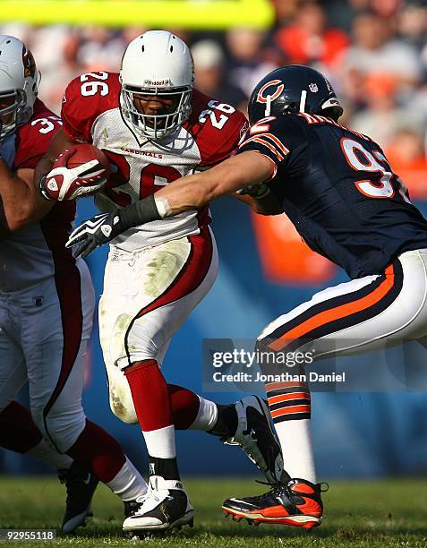 Beanie Wells of the Arizona Cardinals is hit by Hunter Hillenmeyer of the Chicago Bears at Soldier Field on November 8, 2009 in Chicago, Illinois....