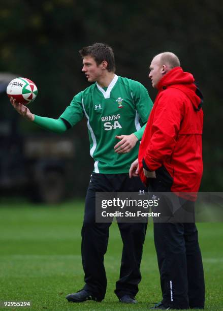 Wales coach Neil Jenkins chats to fly half Dan Biggar during Wales Rugby training at the Vale on November 10, 2009 in Cardiff, Wales.