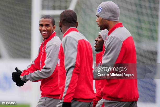 Ashley Young of England shares a joke with team mates Darren Bent, Shaun Wright-Phillips and Joleon Lescott during an England training session at...