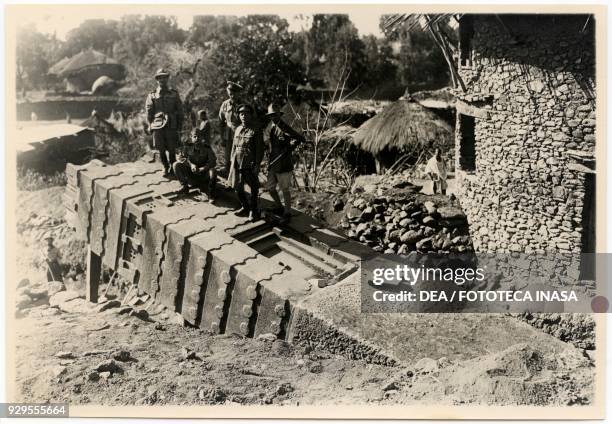 The archaeologist Ugo Monneret de Villard and the Italian military personnel recovering a stele to transport it to Italy, Axum, Ethiopia, 1935-1936.