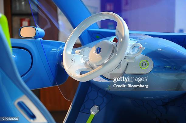 The interior of a Renault SA Twizy Z.E. Concept electric automobile is seen at a showroom in Paris, France, on Tuesday, Nov. 10, 2009. France aims to...