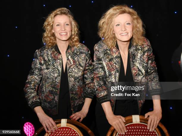 Actress Alexandra Lamy poses with her wax statue during Alexandra Lamy waxwork unveiling at Musee Grevin on March 8, 2018 in Paris, France.