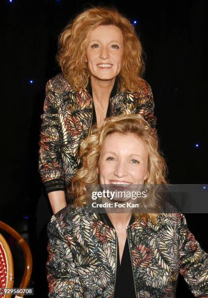 Actress Alexandra Lamy poses with her wax statue during Alexandra Lamy waxwork unveiling at Musee Grevin on March 8, 2018 in Paris, France.