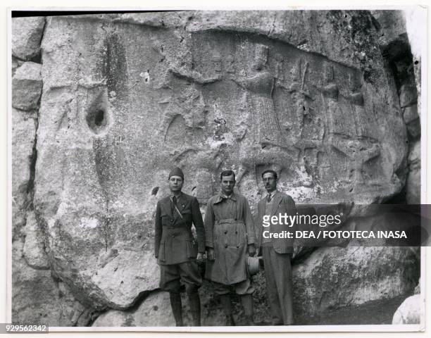 Bas-relief in the Yazilikaya Hittite rock sanctuary, with the German archaeologist Kurt Bittel in the centre, Turkey, 1931.