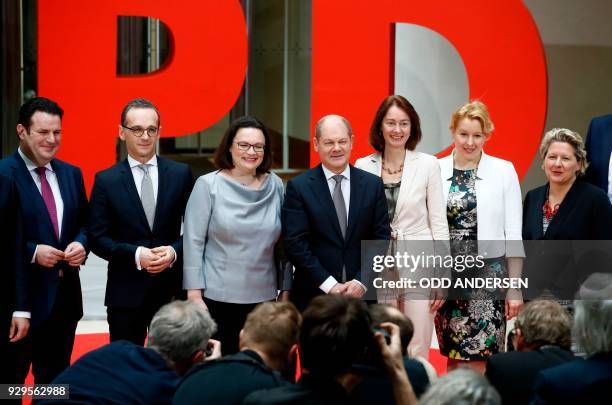 Social Democrats party leaders Andrea Nahles and Olaf Scholz pose next to designated Germann Labour Minister Hubertus Heil, designated German Foreign...
