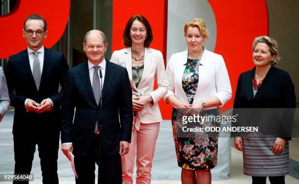 Social Democrats party leader Olaf Scholz poses next to designated German Foreign minister Heiko Maas, designated German Justice Minister Katarina...