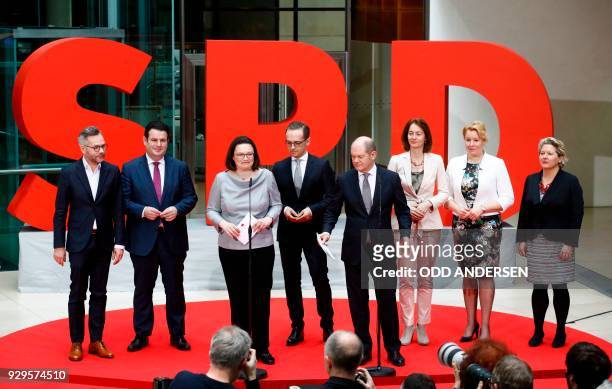 Social Democrats party leaders Andrea Nahles and Olaf Scholz pose next to , designated State Minister Michael Roth, designated German Labour Minister...