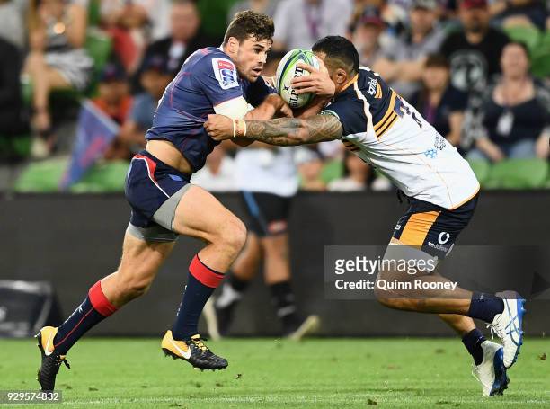 Tom English of the Rebels is tackled during the round four Super Rugby match between the Rebels and the Brumbies at AAMI Park on March 9, 2018 in...
