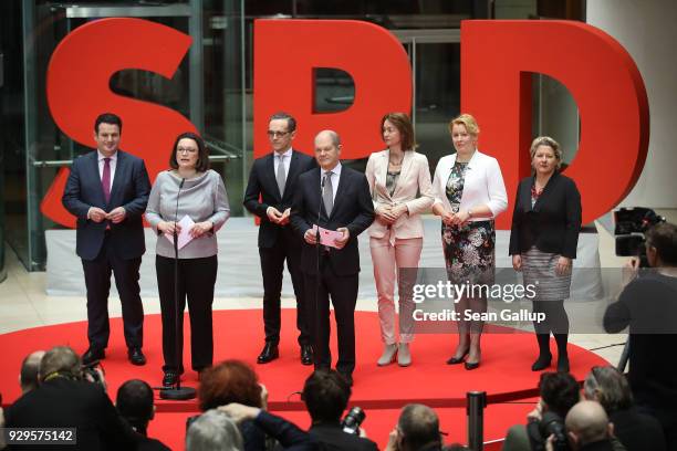 Andrea Nahles and Olaf Scholz of the German Social Democrats present their members of the next German government cabinet: Hubertus Heil, who is to...