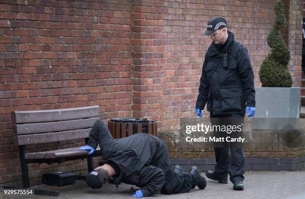 Police officers search ahead of the visit by Home Secretary Amber Rudd to the scene at the Maltings shopping centre in where former Russian double...