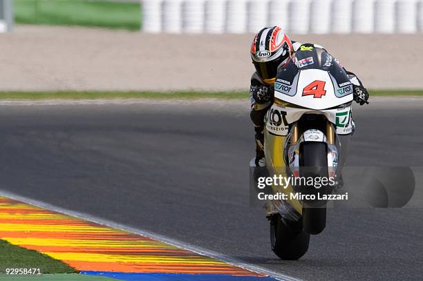Hiroshi Aoyama of Japan and Interwetten Racing Team lifts his front wheel during testing at the Valencia Circuit on November 10, 2009 in Valencia,...