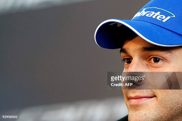 Brazilian Bruno Senna smiles during a press conference for his official presentation as driver of the Campos Meta Formula One team on November 10,...