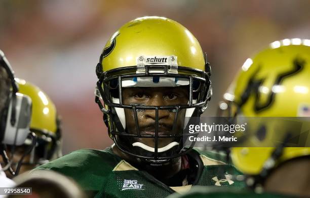 Defensive end George Selvie of the South Florida Bulls watches his team against the West Virginia Mountaineers during the game at Raymond James...